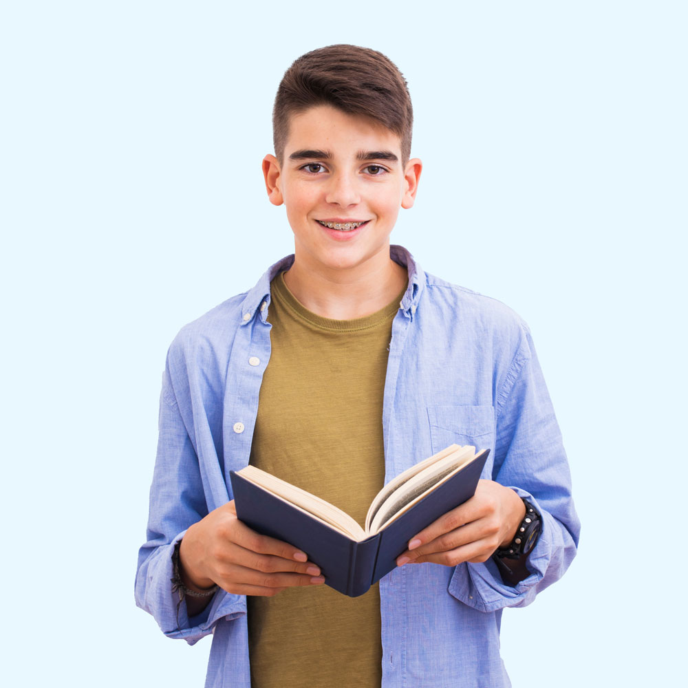 Teen-aged boy reading a book