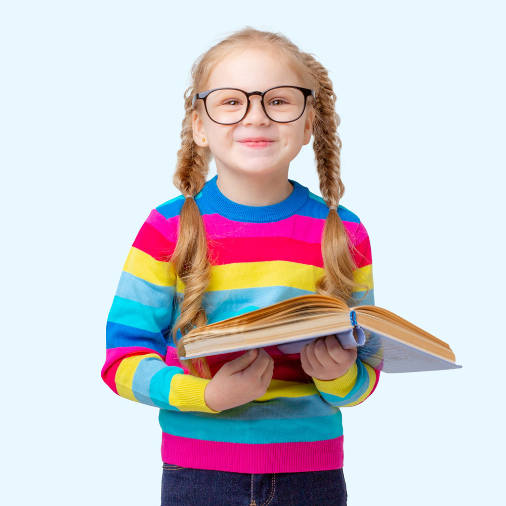 Young girl in brightly colored sweater reading